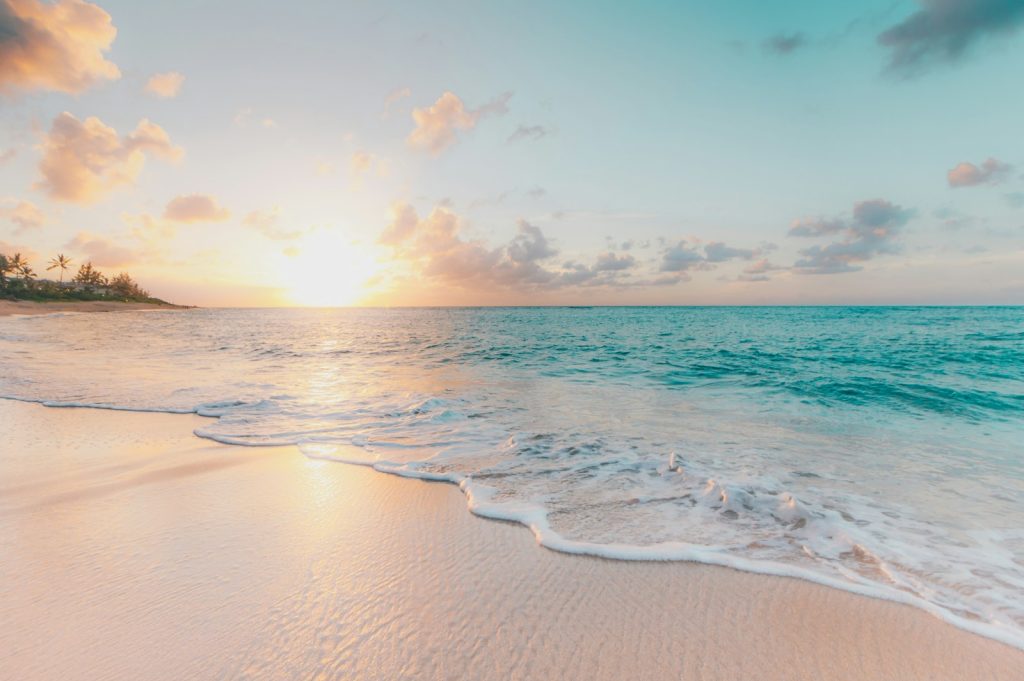 Calm shoreline at dusk with soft reflective light